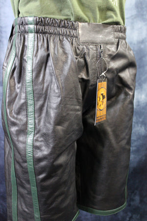 Pantalones cortos de baloncesto en negro y verde cazador