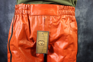 Pantalones cortos de baloncesto en naranja y negro