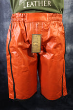 Pantalones cortos de baloncesto en naranja y negro