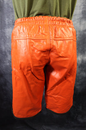 Pantalones cortos de baloncesto en naranja y negro