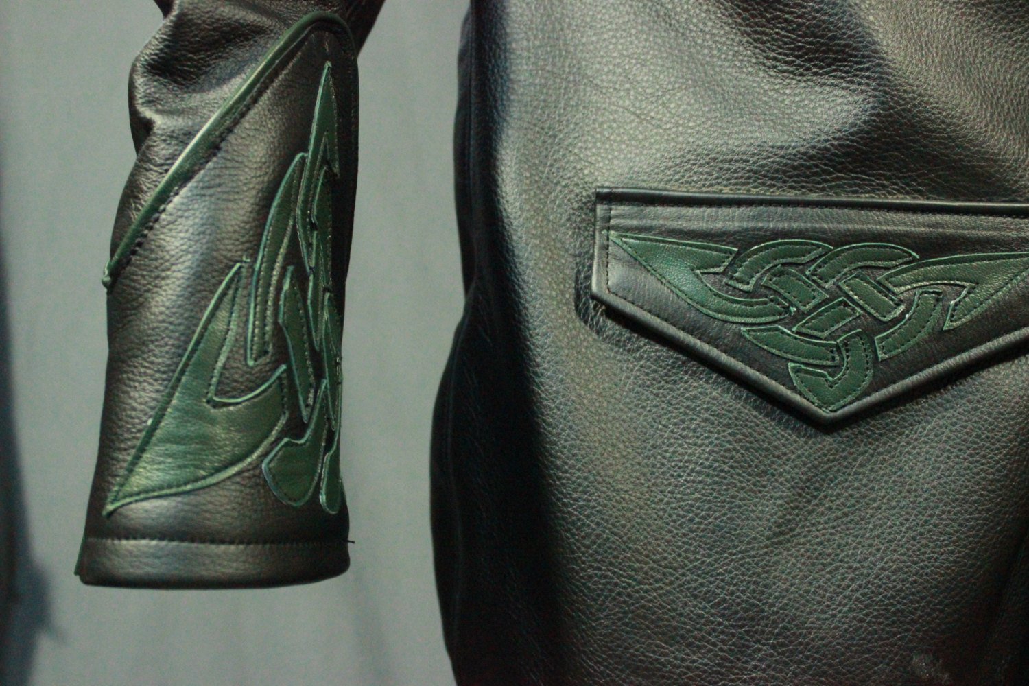 Leather dress coat with celtic highlights in forrest green.