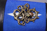 ¡Puño de raya azul con pin personalizado de Curiosidades victorianas!