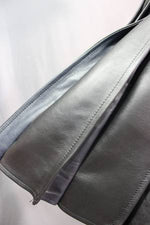 Falda escocesa de cuero plisada